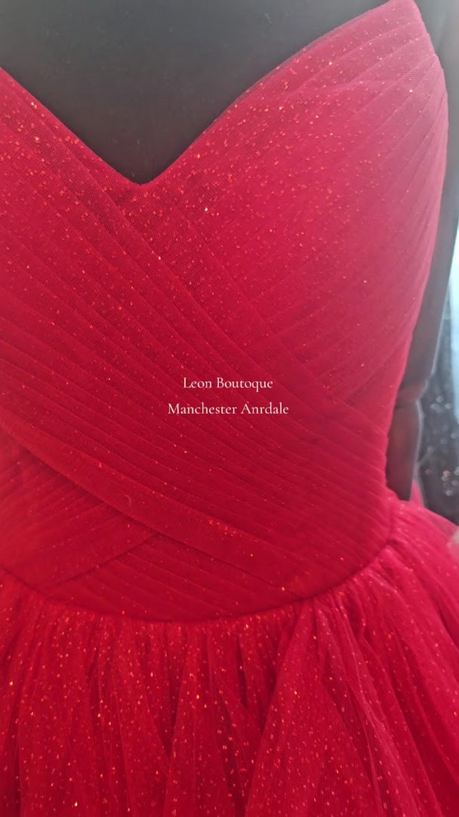 Detail of a red tulle gown