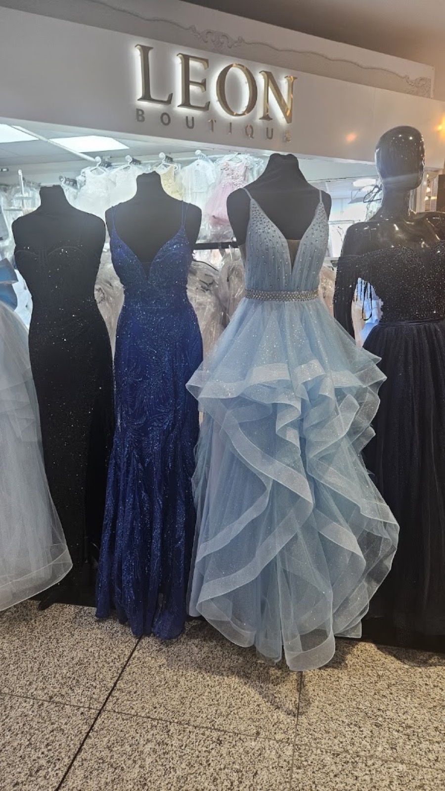 Leon Boutique display with evening gowns