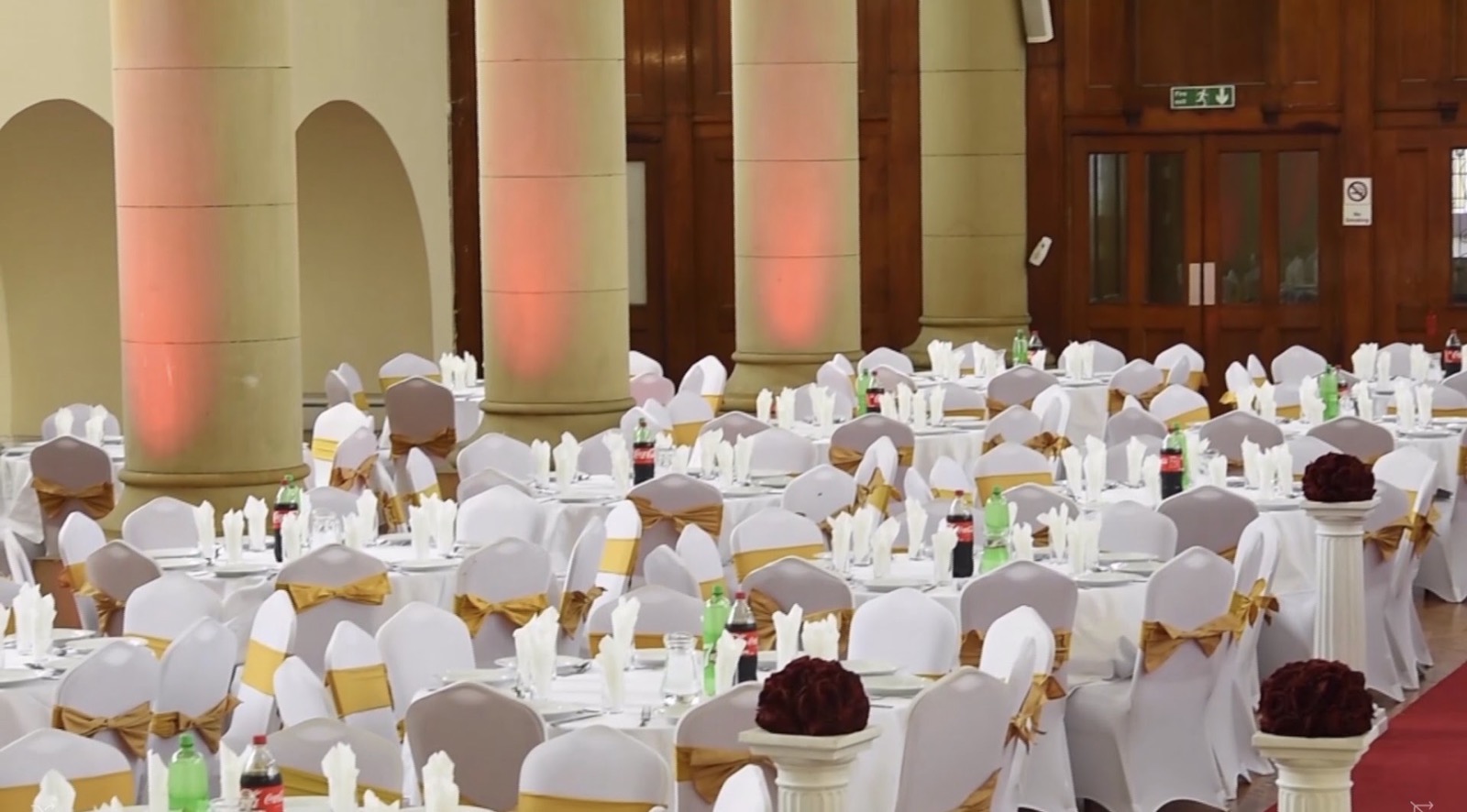 Banquet tables dressed in white and gold