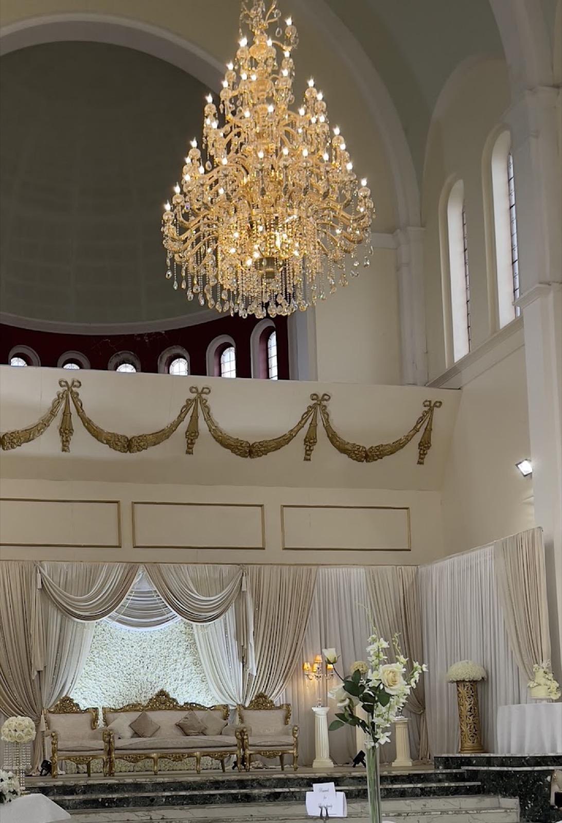 Chandelier and stage draping inside the hall